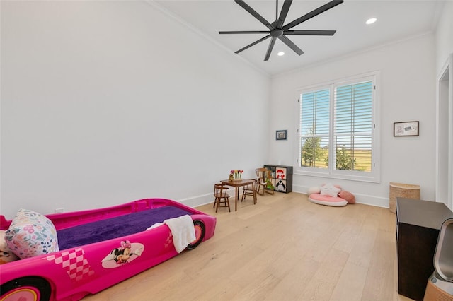 bedroom featuring crown molding, ceiling fan, and wood-type flooring