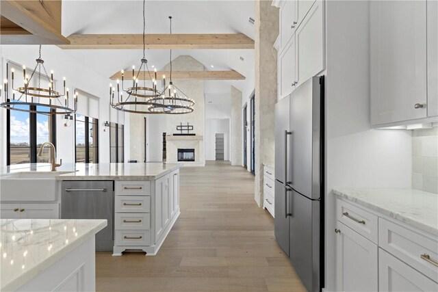 dining space featuring light wood-type flooring and a chandelier