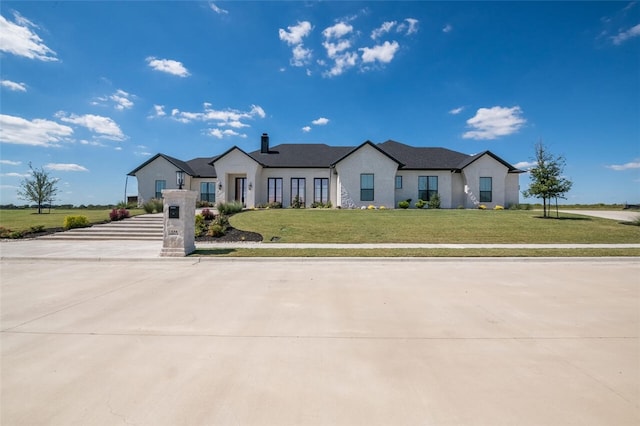 view of front of house with a front lawn