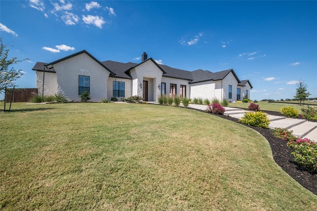 view of front of home with a front lawn