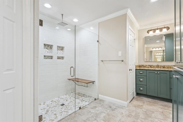 bathroom with vanity, ornamental molding, and walk in shower