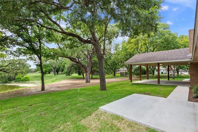 view of community featuring a patio area and a lawn