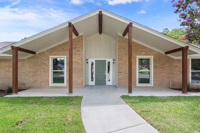 exterior space with a lawn and a patio