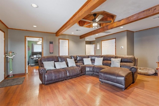 living room featuring beam ceiling, light wood-type flooring, ceiling fan, and crown molding