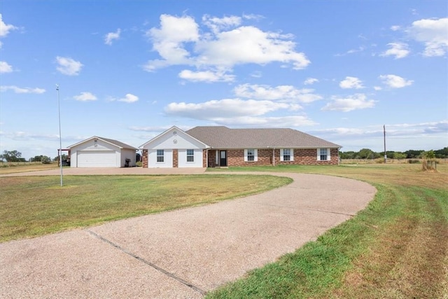 ranch-style home featuring a front yard and a garage