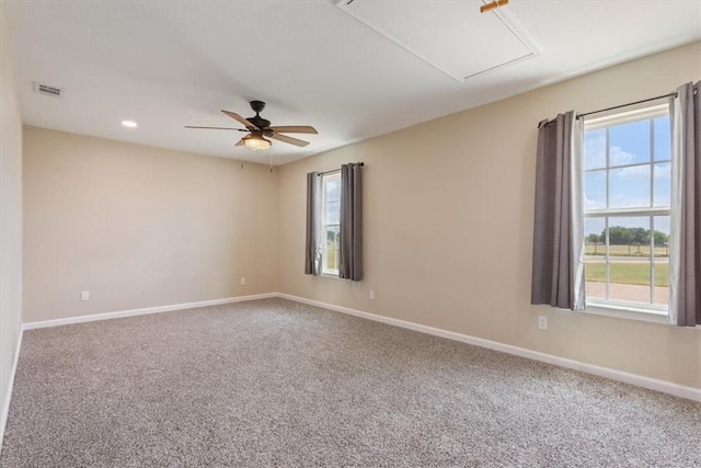 carpeted empty room featuring ceiling fan