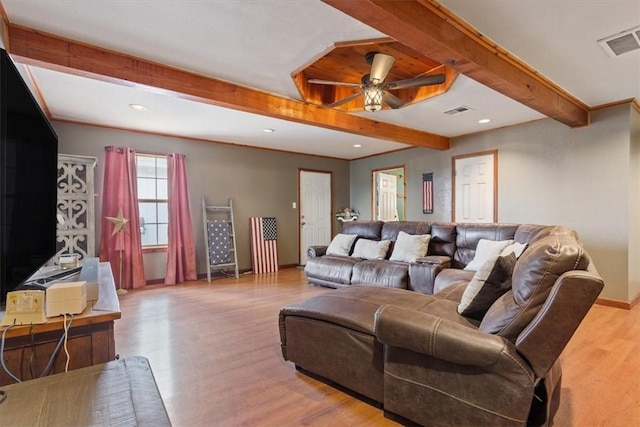 living room with beamed ceiling, light wood-type flooring, and ceiling fan