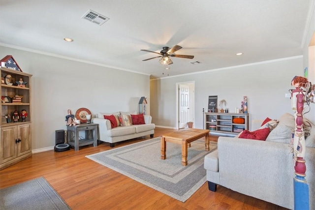 living room featuring ceiling fan, hardwood / wood-style floors, and ornamental molding