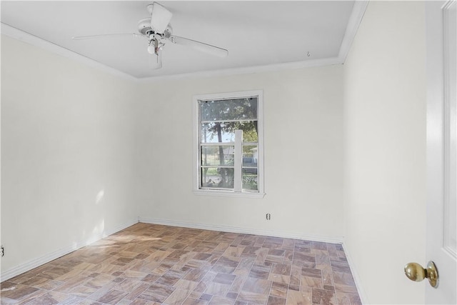 spare room with crown molding, light parquet flooring, and ceiling fan