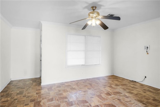 spare room featuring ceiling fan and ornamental molding