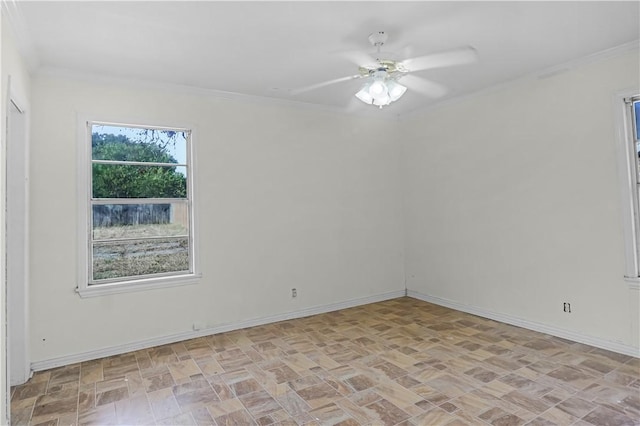 unfurnished room with ceiling fan and crown molding