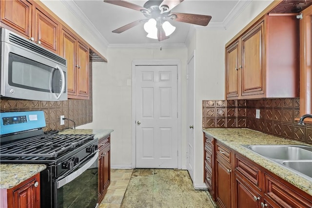 kitchen featuring crown molding, sink, stainless steel appliances, and tasteful backsplash