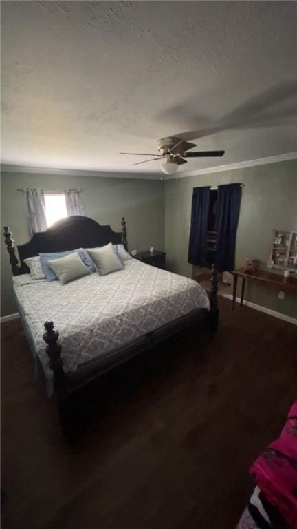 bedroom featuring a textured ceiling, wood finished floors, and ceiling fan