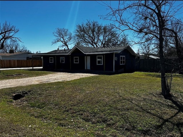 view of front of property with a front yard and fence