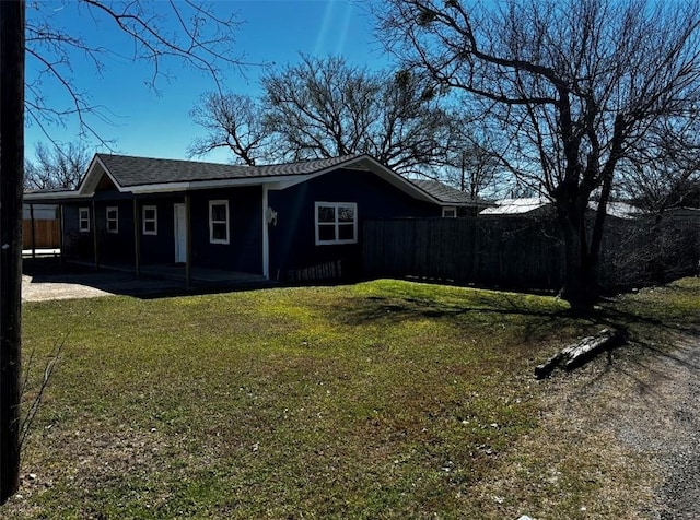 exterior space with a yard and fence