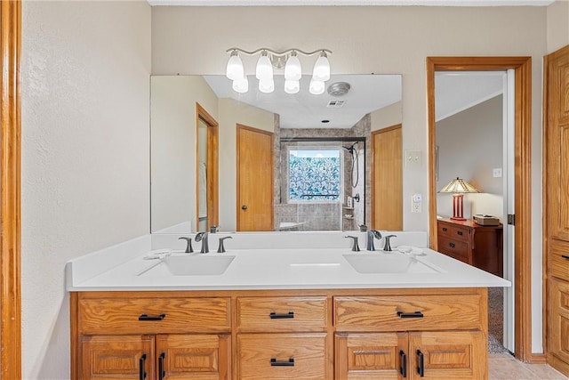 bathroom featuring tile patterned flooring and vanity