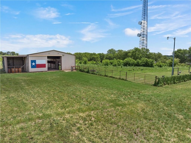 view of yard featuring an outbuilding and a rural view