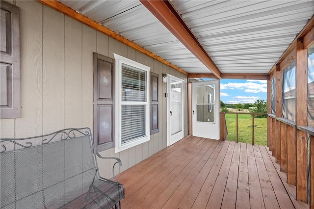 wooden deck with a lawn