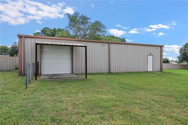 view of outbuilding with a yard