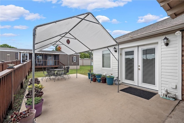 view of patio / terrace with a gazebo and a storage unit