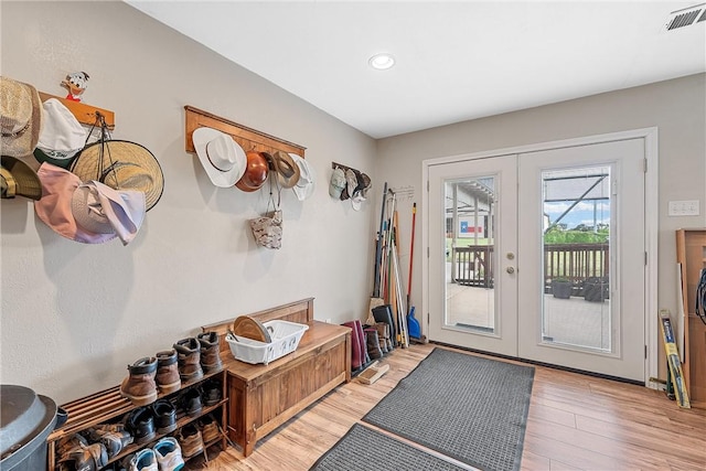 doorway to outside featuring french doors and light hardwood / wood-style floors