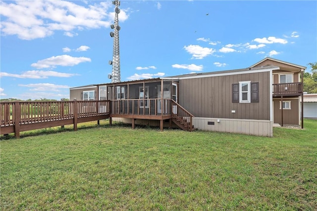 back of house featuring a sunroom and a yard