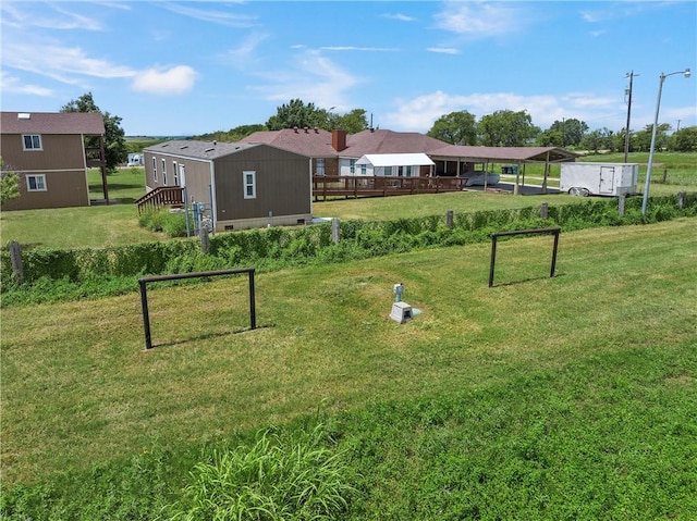 view of property's community with a yard