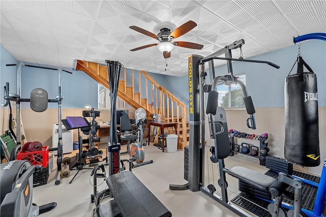 exercise room with ceiling fan