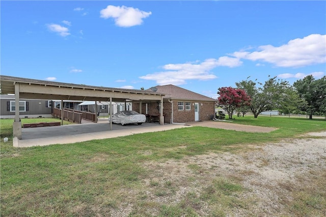 exterior space with a front yard and a carport