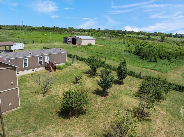 birds eye view of property with a rural view