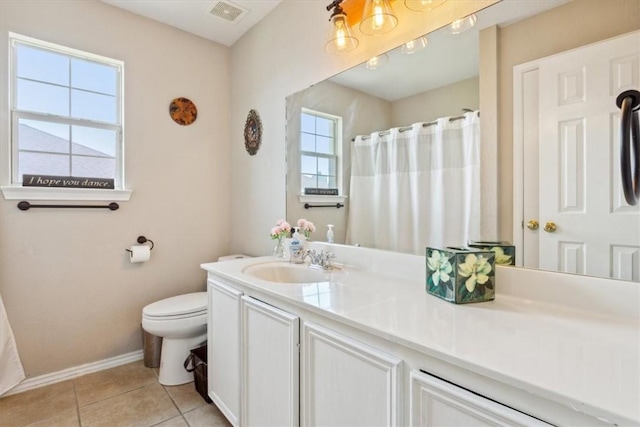 bathroom featuring tile patterned floors, vanity, and toilet