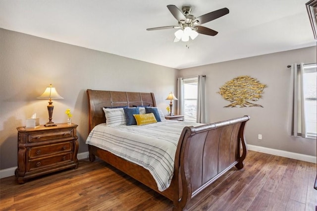 bedroom with ceiling fan and dark wood-type flooring