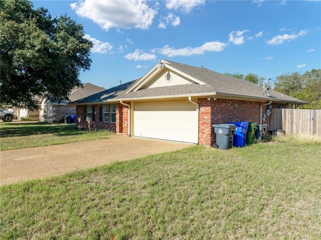 ranch-style home featuring a front yard and a garage