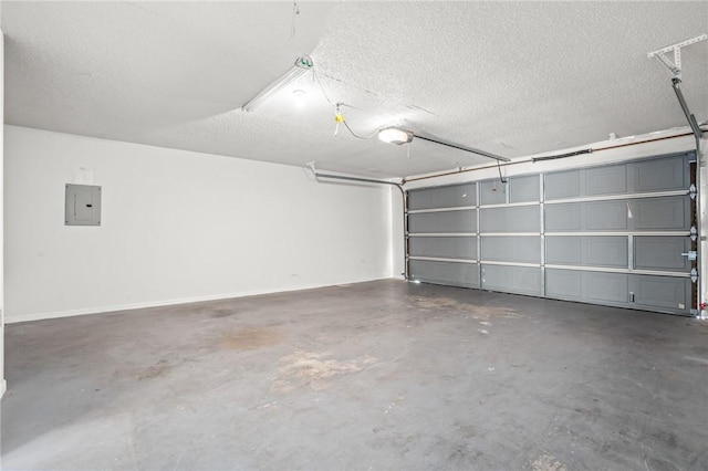 garage featuring electric panel and a garage door opener