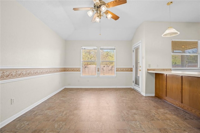 interior space featuring ceiling fan and lofted ceiling