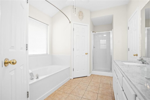 bathroom featuring separate shower and tub, tile patterned flooring, and vanity