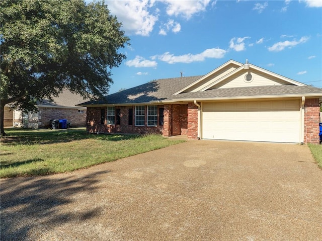 single story home with a front yard and a garage