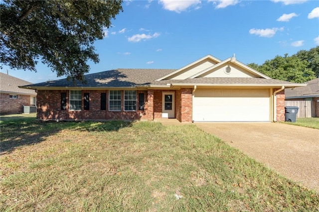 ranch-style home with a front lawn, a garage, and central AC unit