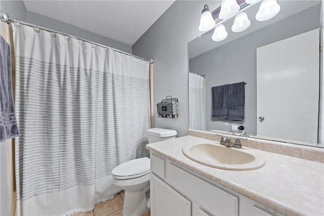 bathroom featuring vanity, a textured ceiling, tile patterned floors, and toilet