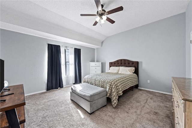 bedroom with carpet flooring, ceiling fan, a textured ceiling, and vaulted ceiling