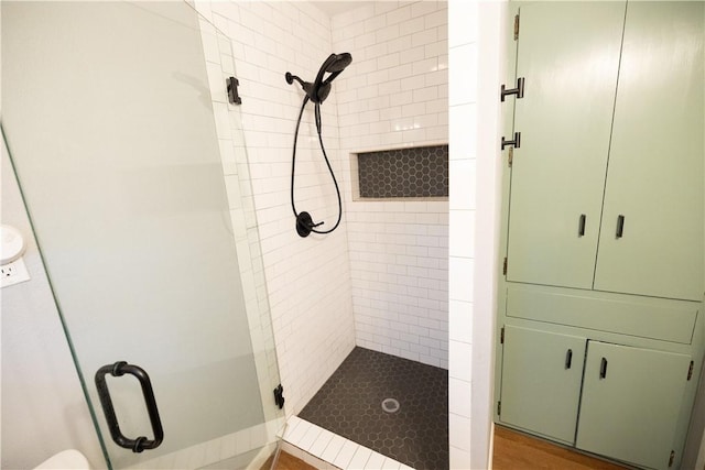 bathroom with a shower stall