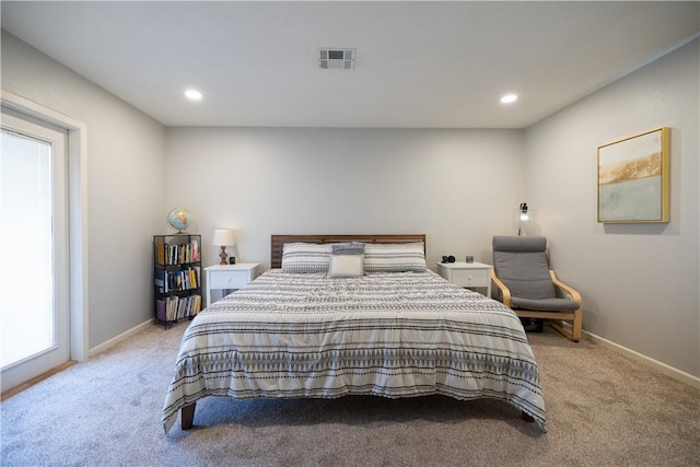 bedroom with recessed lighting, visible vents, light carpet, and baseboards