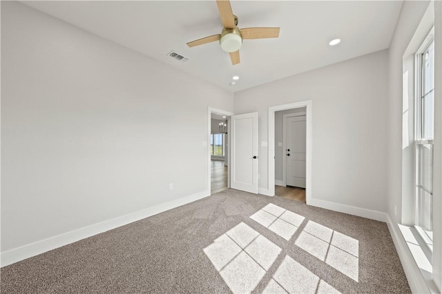 unfurnished bedroom with ceiling fan and carpet floors