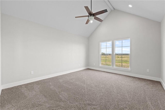 carpeted empty room with ceiling fan and high vaulted ceiling