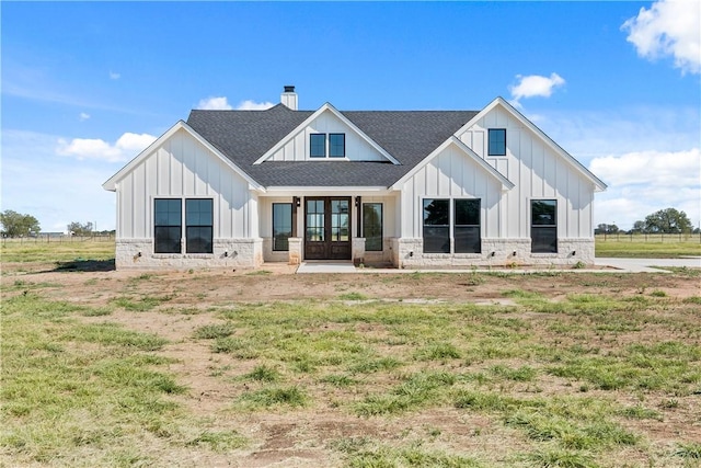 rear view of property with french doors