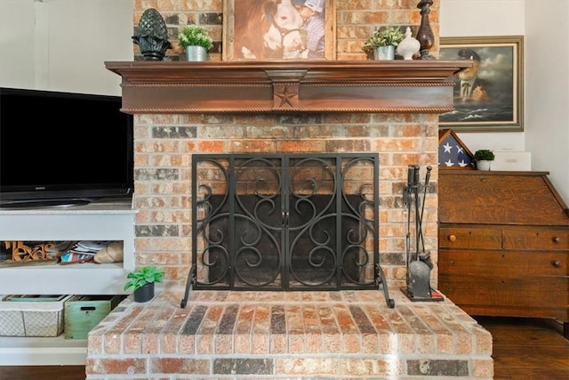 interior details with hardwood / wood-style flooring and a fireplace