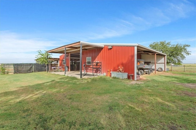 back of property featuring an outdoor structure