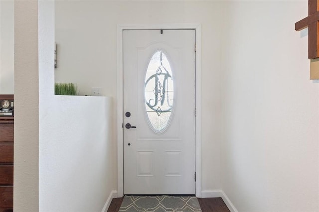 doorway with hardwood / wood-style flooring