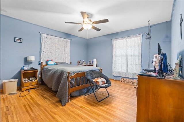 bedroom featuring light hardwood / wood-style flooring and ceiling fan