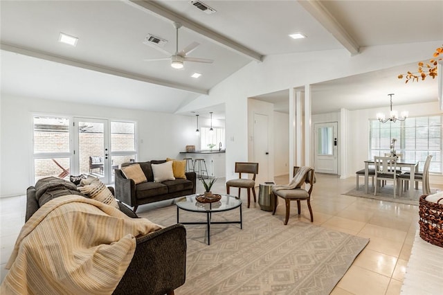 tiled living room with vaulted ceiling with beams and ceiling fan with notable chandelier